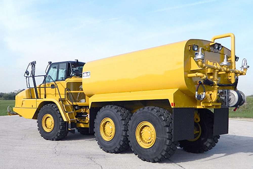 yellow water truck rear driver side view