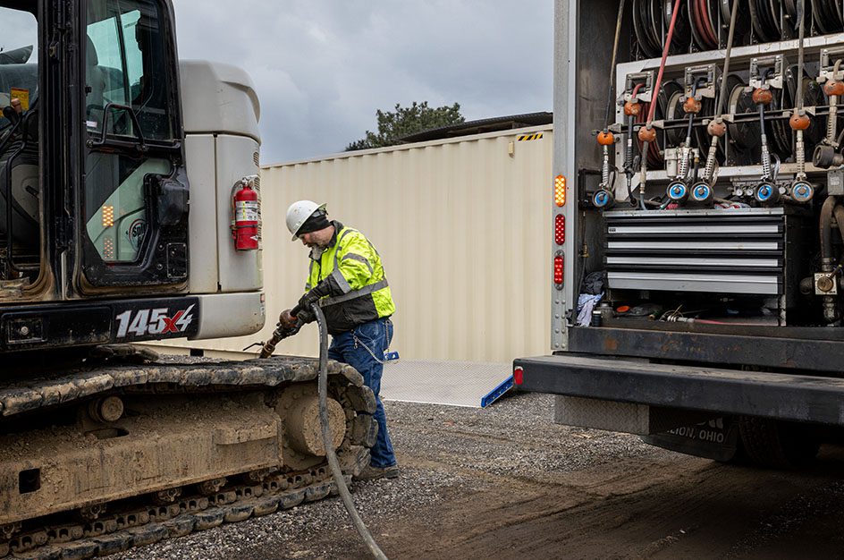 Man fueling up crane from Stellar truck