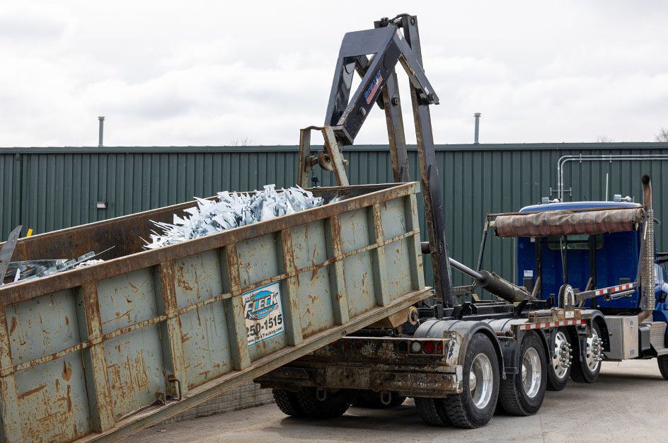 Stellar hooklift carrying demolition container