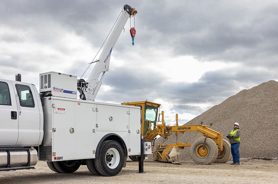 Stellar TMAX2 Mechanic Truck on worksite next to rock pile